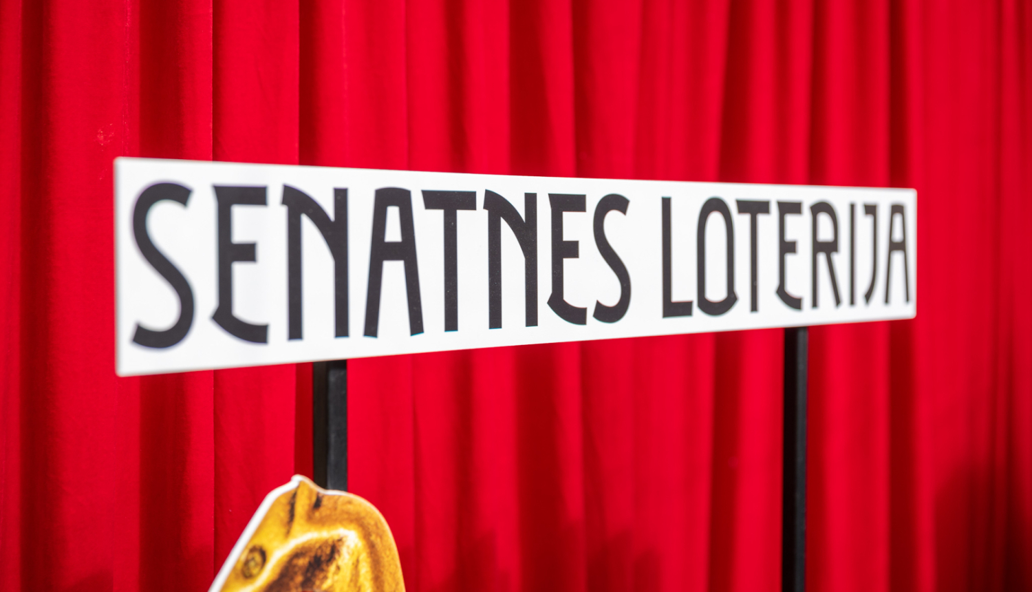 Uzraksts "Senatnes loterija"